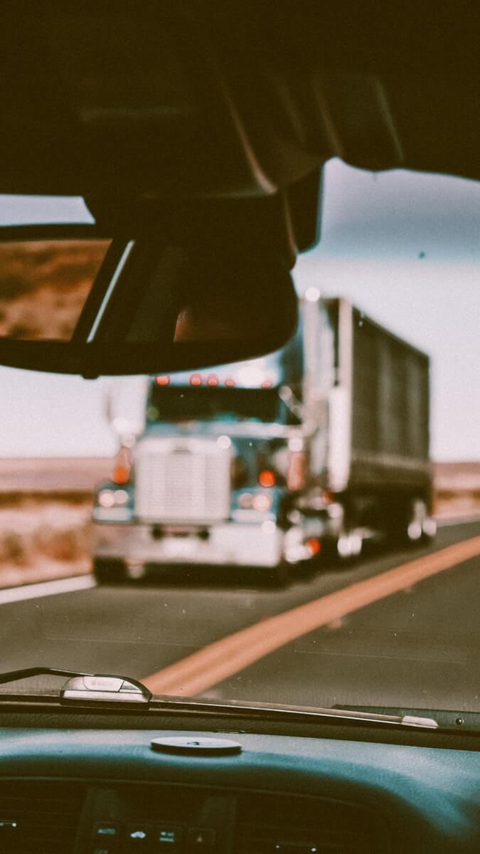 Photo by Ralph (Ravi) Kayden - AArete white truck on road during daytime